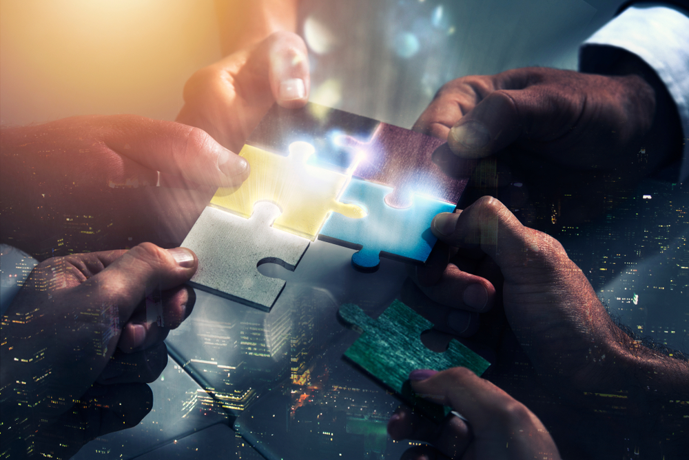 Businessmen,Working,Together,To,Build,A,Puzzle.,Concept,Of,Teamwork,