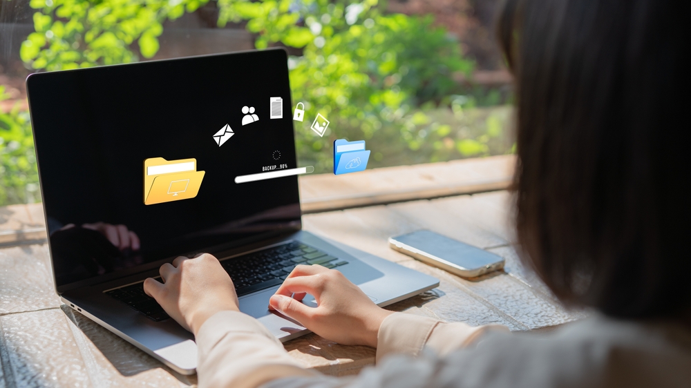 BusinesswomanTransferringBackupBusinessDataToTheCloudBackupData Types of Data Backups & Recovery Strategies