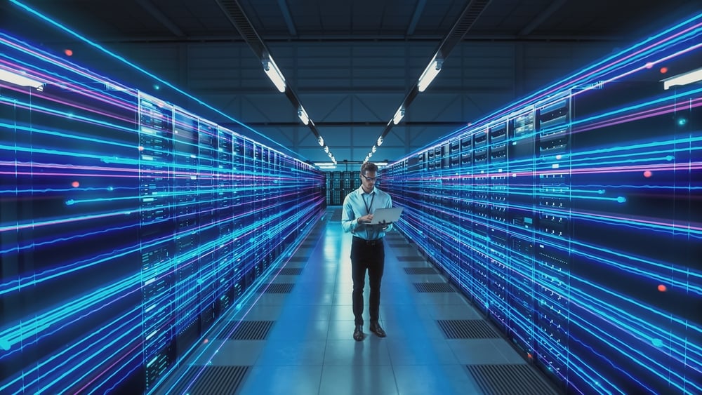 FuturisticConceptDataCenterChiefTechnologyOfficerHoldingLaptopStanding it infrastructure