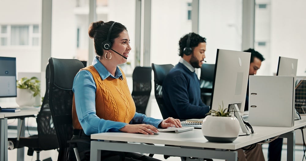 ComputerContactUsAndHappyWomanInCallCenterFor IT help desk