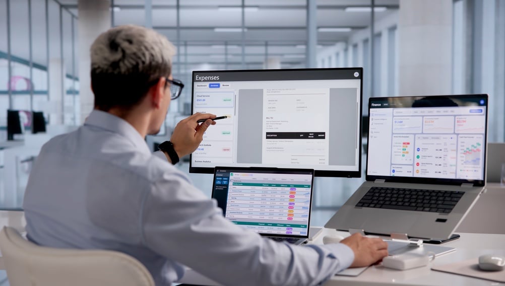 FinancialAnalystMonitorsBusinessExpensesOnLaptopWithCloud-basedSoftware On Laptop With Cloud-Based Software