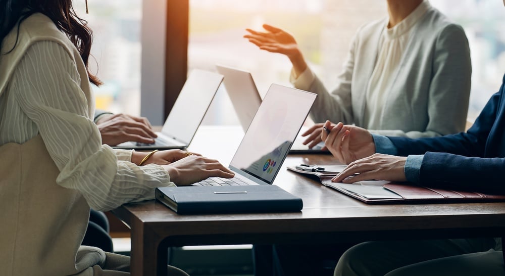 GroupOfCasualBusinessPeopleMeetingInAnOffice Group of casual business people meeting in an office